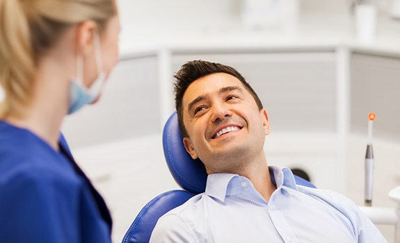 man smiling and understanding the cost of cosmetic dentistry in Rockwall