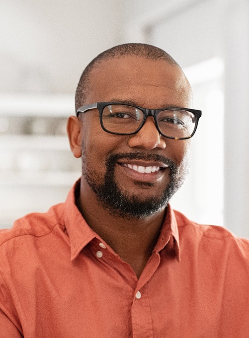 Smiling confident man with dental crowns in Rockwall