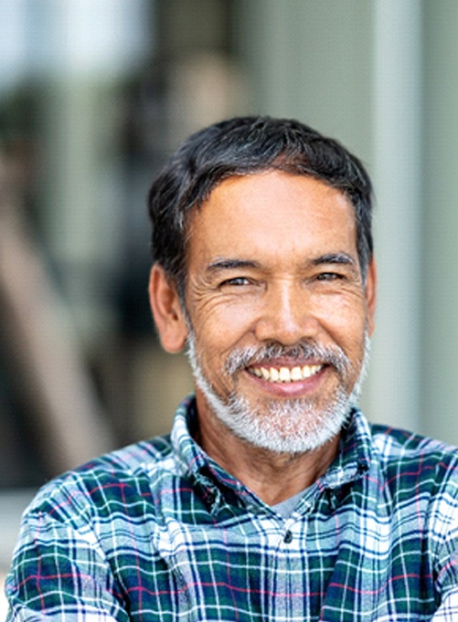 Man smiling with dental bridge in Rockwall