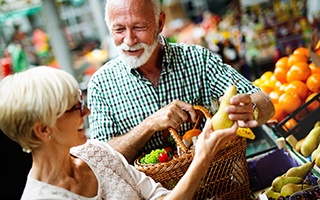 Older couple going grocery shopping