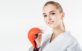 Fighter holding a mouthguard