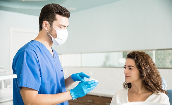 Emergency dentist in Rockwall explaining treatment to a patient