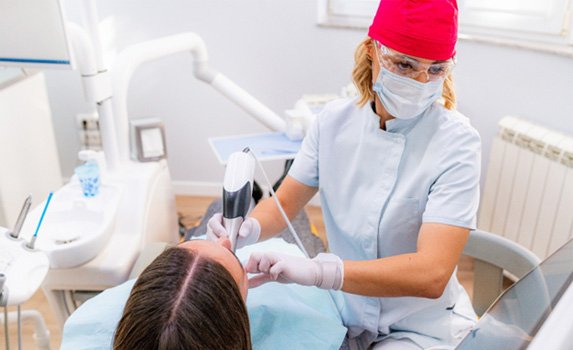 A dentist performing a full mouth reconstruction in Rockwall