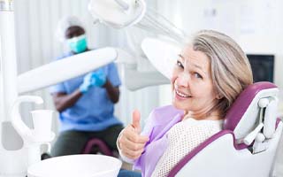 Woman completing a routine dental checkup