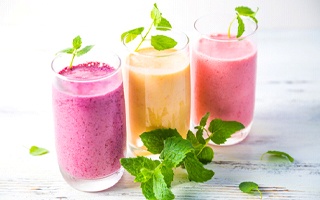 Series of smoothies garnished with mint leaves