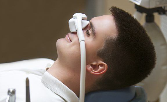 Patient with nitrous oxide dental sedation mask