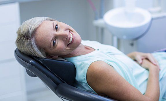 Relaxed woman in dental chair for dental checkups