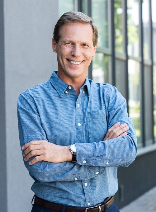 Man smiling after root canal therapy