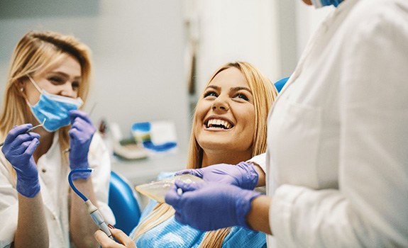 patient talking to dentist about root canal therapy in Rockwall