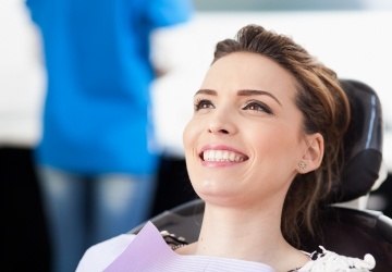 Woman smiling during preventive dentistry appointment