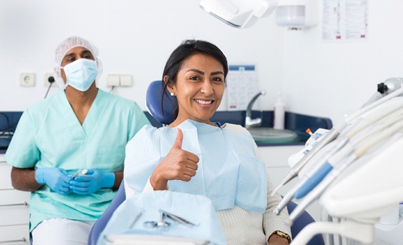 Woman gives thumbs up after treating her toothache in Rockwall