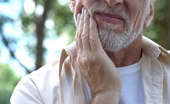 Man suffering from wisdom tooth pain in Rockwall, TX