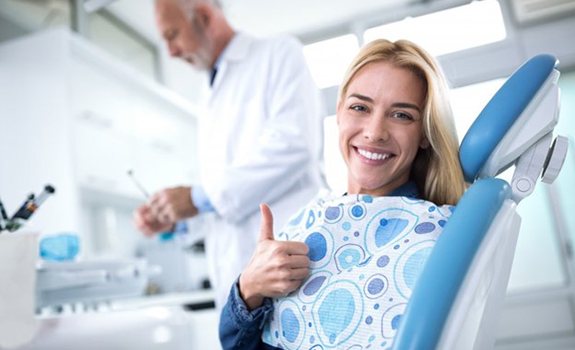 Woman smiling after her wisdom tooth extraction in Rockwall, TX