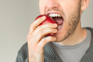 Someone with dentures eating