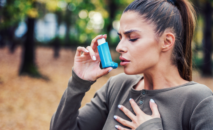 Woman using inhaler