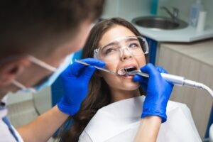 Dentist performing root canal.